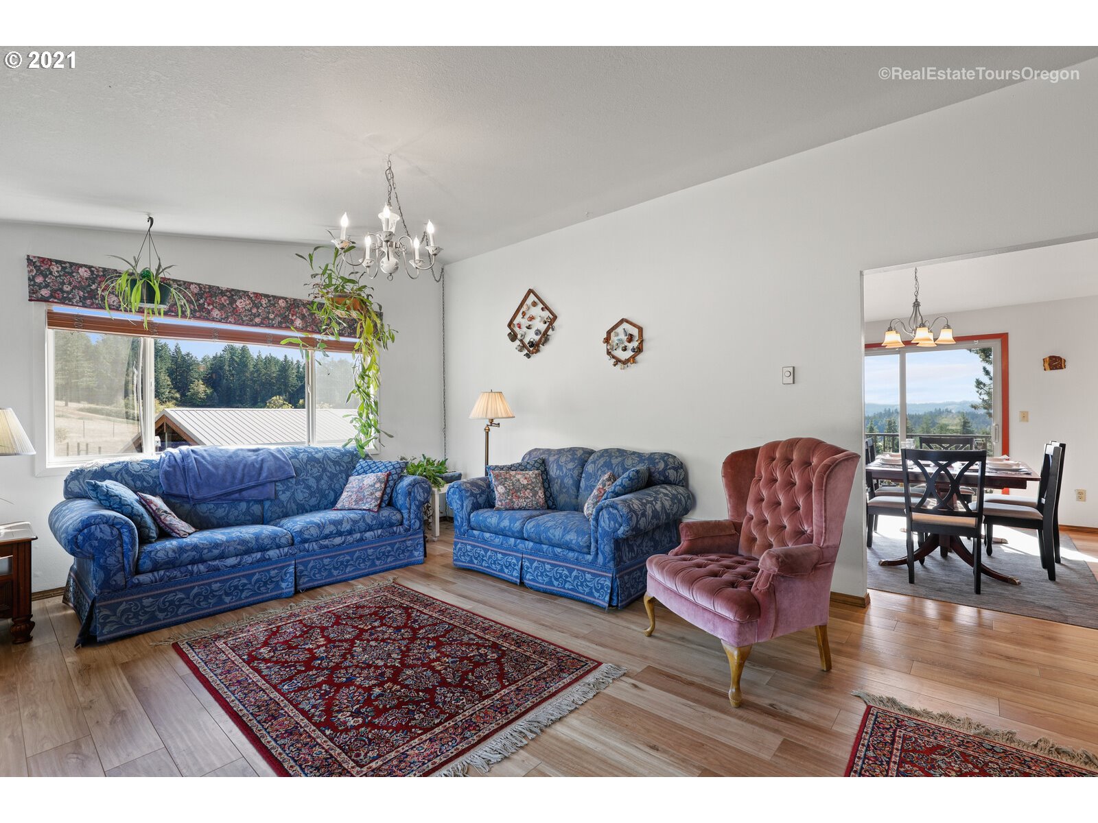 40965 Southwest Vandehey Road Gaston, OR 97119 - Photo 7 of 32 a living room with furniture and a chandelier