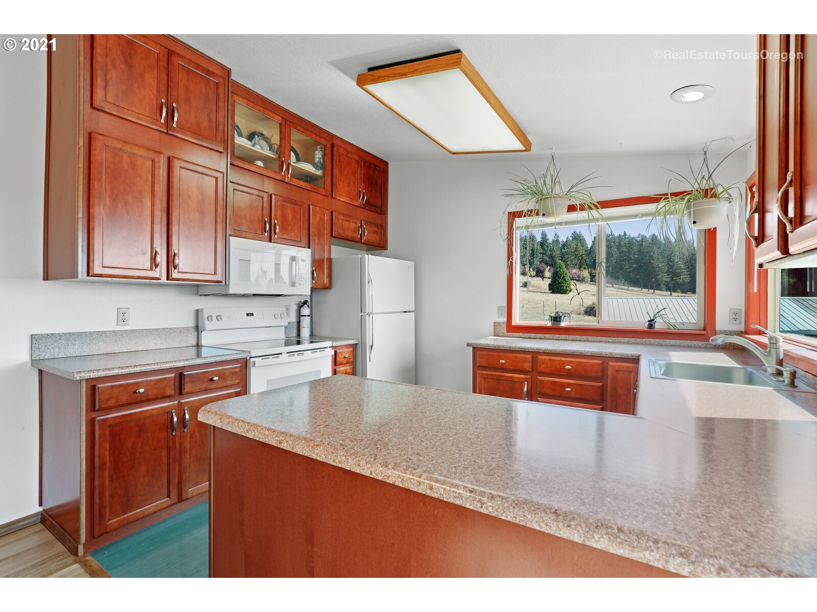 40965 Southwest Vandehey Road Gaston, OR 97119 - Photo 9 of 32 a kitchen with stainless steel appliances granite countertop a refrigerator and a stove