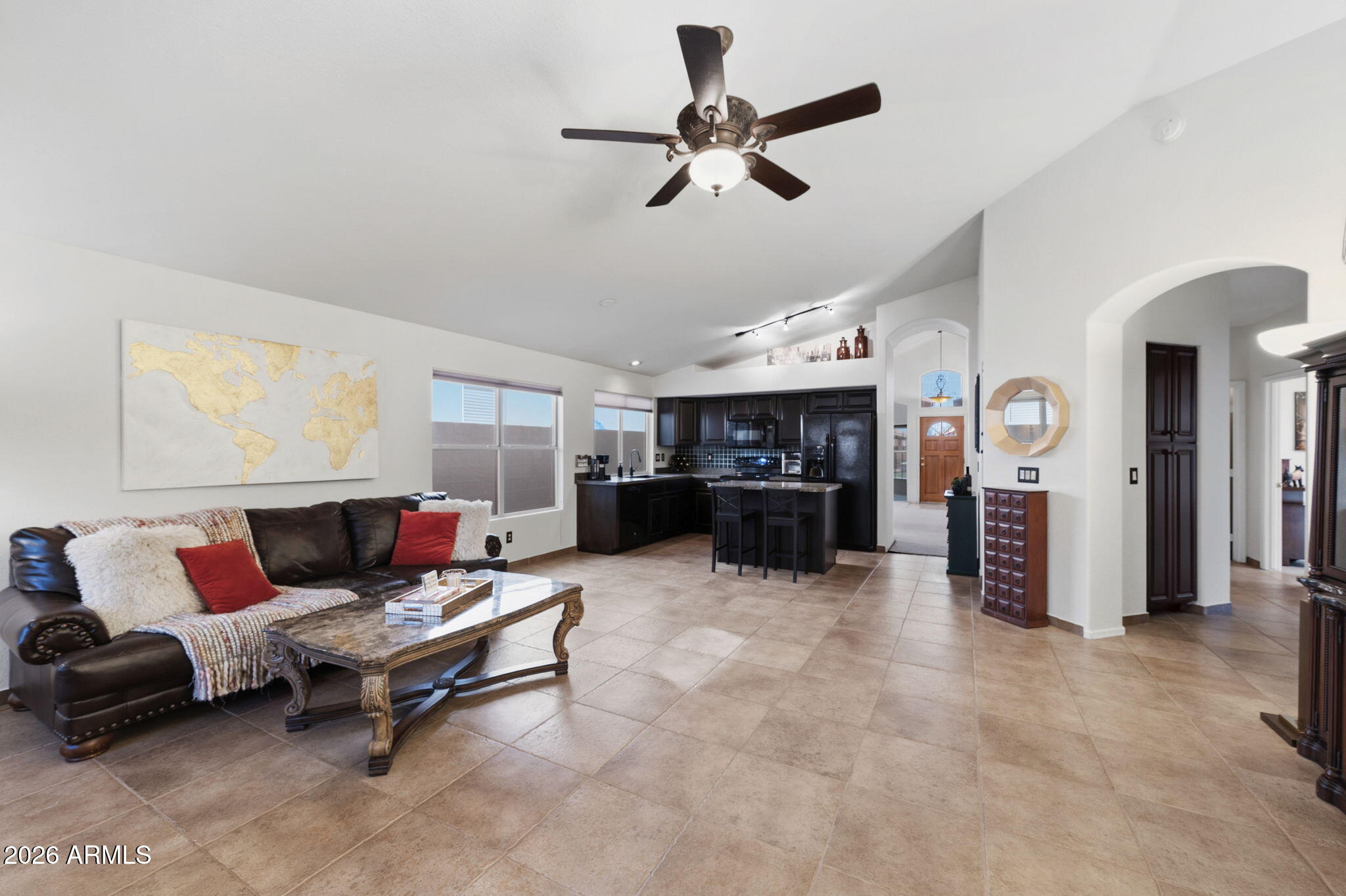 6526 East Raftriver Street Mesa, AZ 85215 - Photo 5 of 17 a living room with furniture and kitchen view