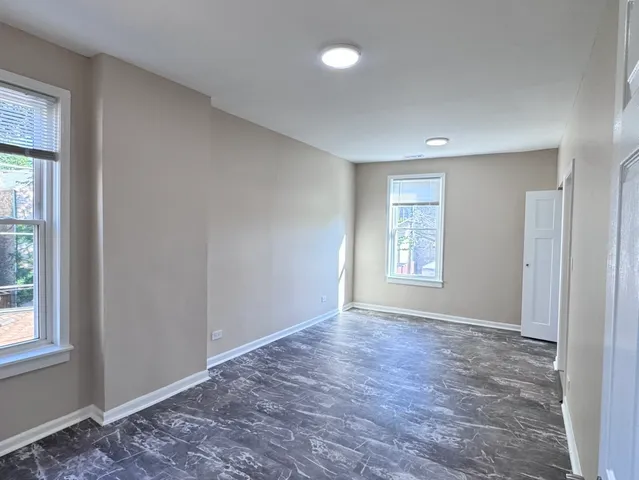 a view of an empty room with a window