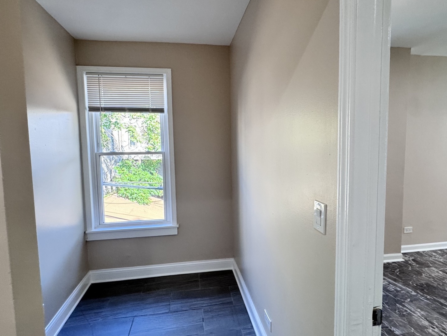 1315 West 18th Street, Unit 2 Chicago, IL 60608 - Photo 13 of 19 a view of room with window and hardwood floor