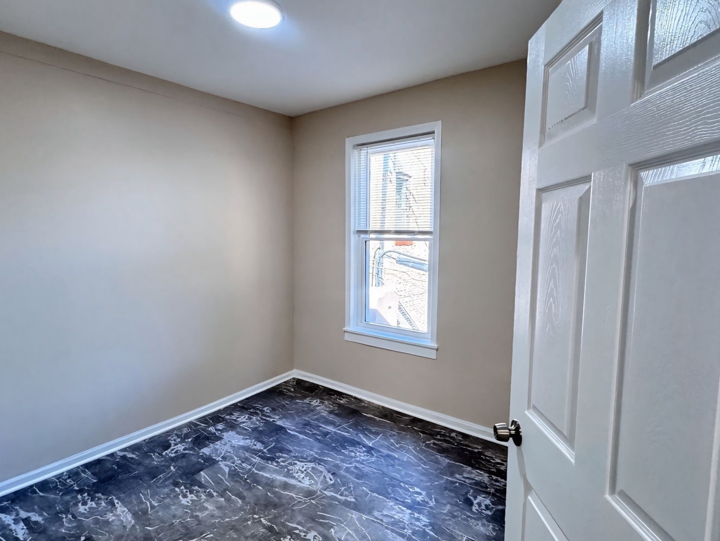 1315 West 18th Street, Unit 2 Chicago, IL 60608 - Photo 15 of 19 an empty room with a window