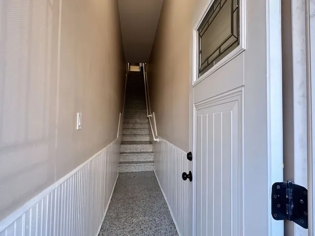 a view of a hallway with stairs
