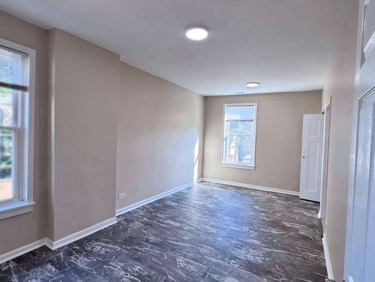 1315 West 18th Street, Unit 2 Chicago, IL 60608 - Photo 6 of 19 a view of an empty room with window and closet area