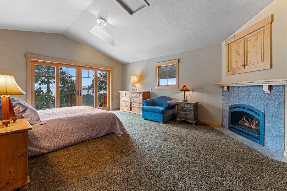 424 Chipmunk Street Kings Beach, CA 96143 - Photo 11 of 21 a bed room with a bed and a fireplace