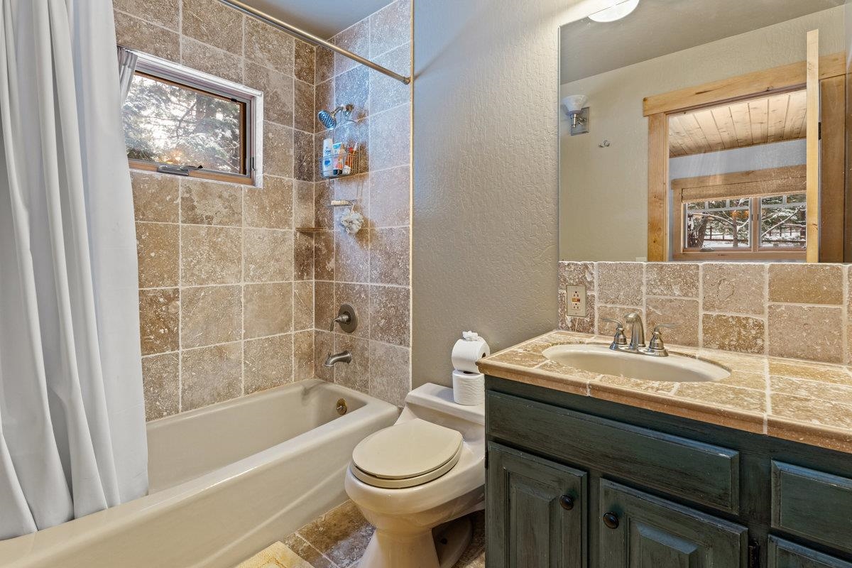 424 Chipmunk Street Kings Beach, CA 96143 - Photo 14 of 21 a bathroom with a sink a toilet and shower