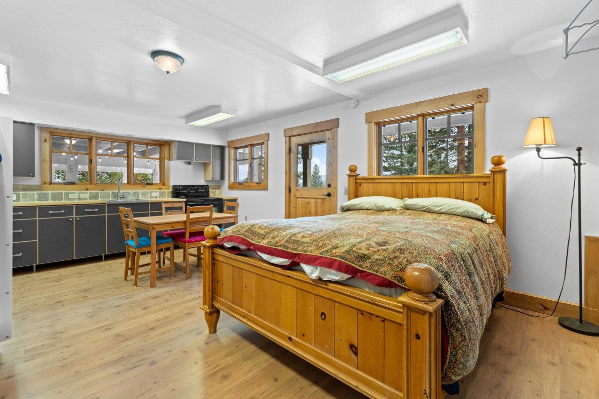 424 Chipmunk Street Kings Beach, CA 96143 - Photo 18 of 21 a bed sitting in a room next to a window with kitchen view