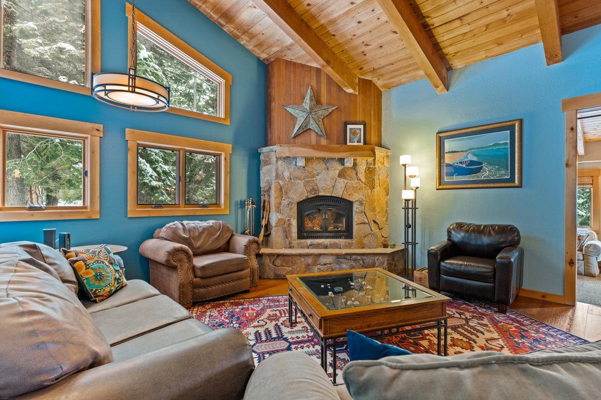 424 Chipmunk Street Kings Beach, CA 96143 - Photo 7 of 21 a living room with furniture a fireplace and a large window