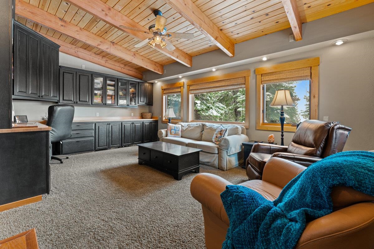 424 Chipmunk Street Kings Beach, CA 96143 - Photo 10 of 21 a living room with furniture a ceiling fan and a large window