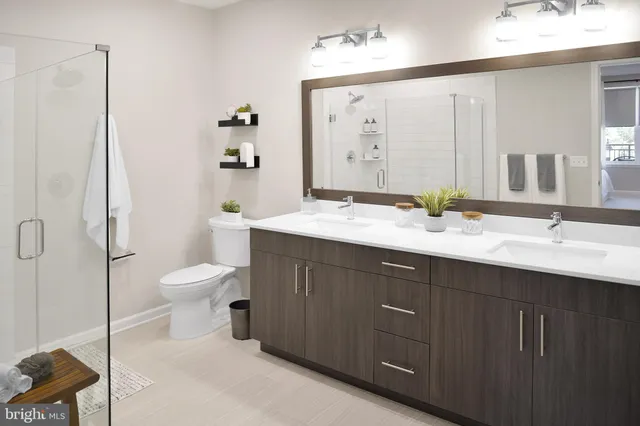 a view of a workspace room with furniture and a potted plant