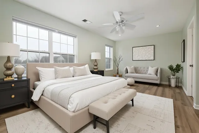 a spacious bedroom with a bed and window