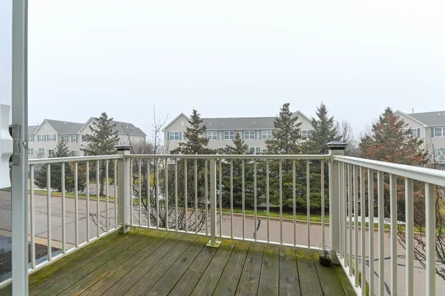 a view of a balcony with wooden floor
