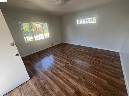 a view of an empty room and window