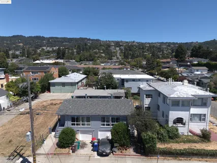 a view of a house with a cars park