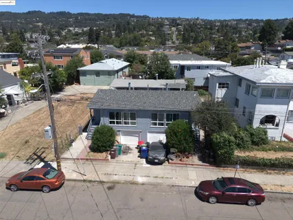 an aerial view of a house with garden space