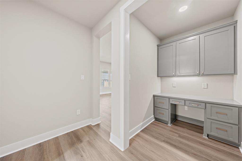 9824 Durango Trail Waco, TX 76712 - Photo 14 of 30 Unfurnished office featuring built in study area and light wood-style flooring