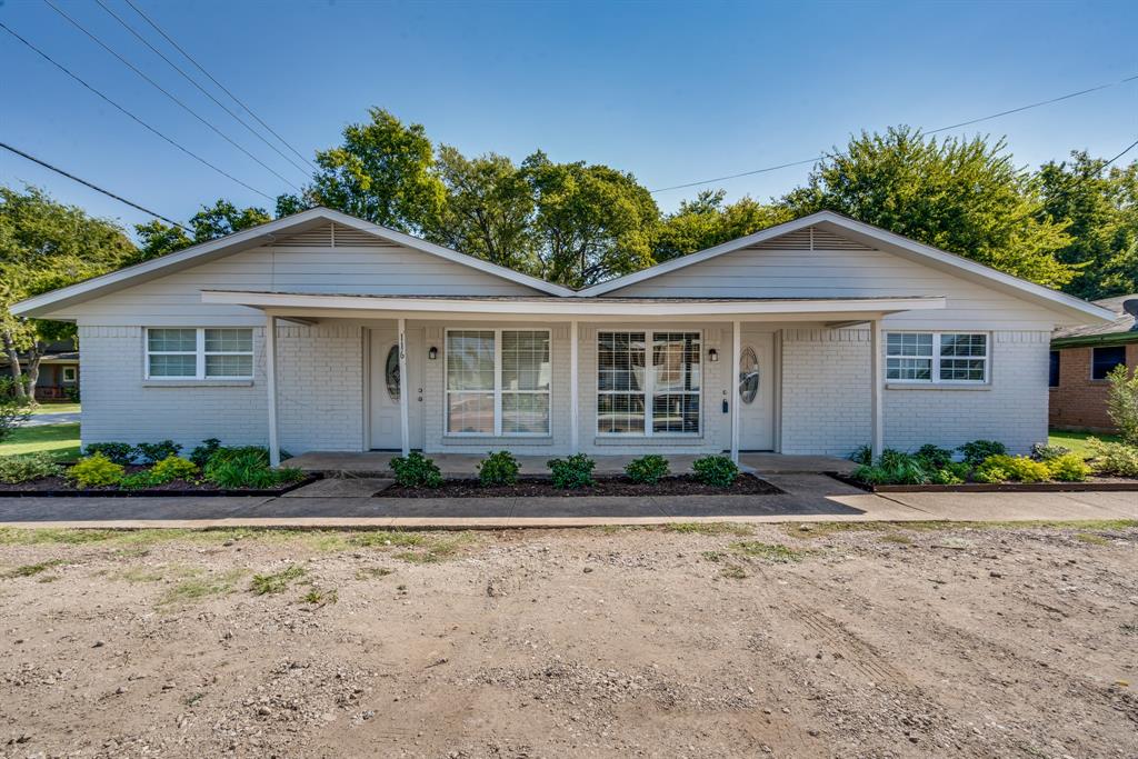 116 North 12th Street, Unit B Midlothian, TX 76065 - Photo 4 of 24 a front view of a house with a yard