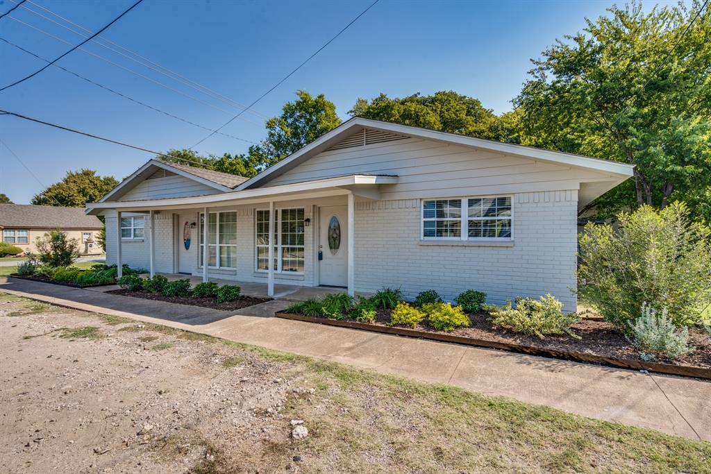 116 North 12th Street, Unit B Midlothian, TX 76065 - Photo 8 of 24 front view of a house with a yard