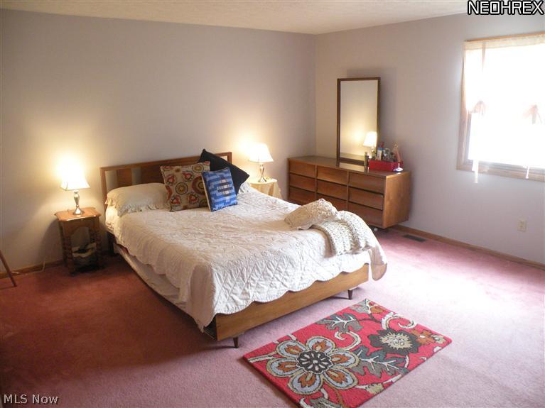 4656 Hattrick Road Ravenna, OH 44266 - Photo 15 of 24 The master bedroom features two closets and a full bath.