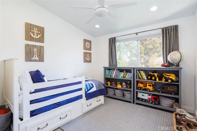 a bedroom with furniture and a window