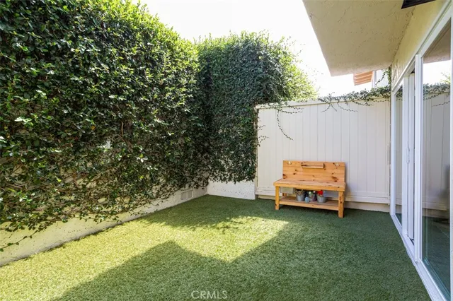 a view of a backyard with swimming pool