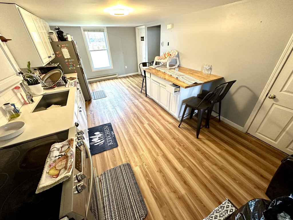 76 Everton Avenue Worcester, MA 01604 - Photo 15 of 38 a room with wooden floor pool table and chairs