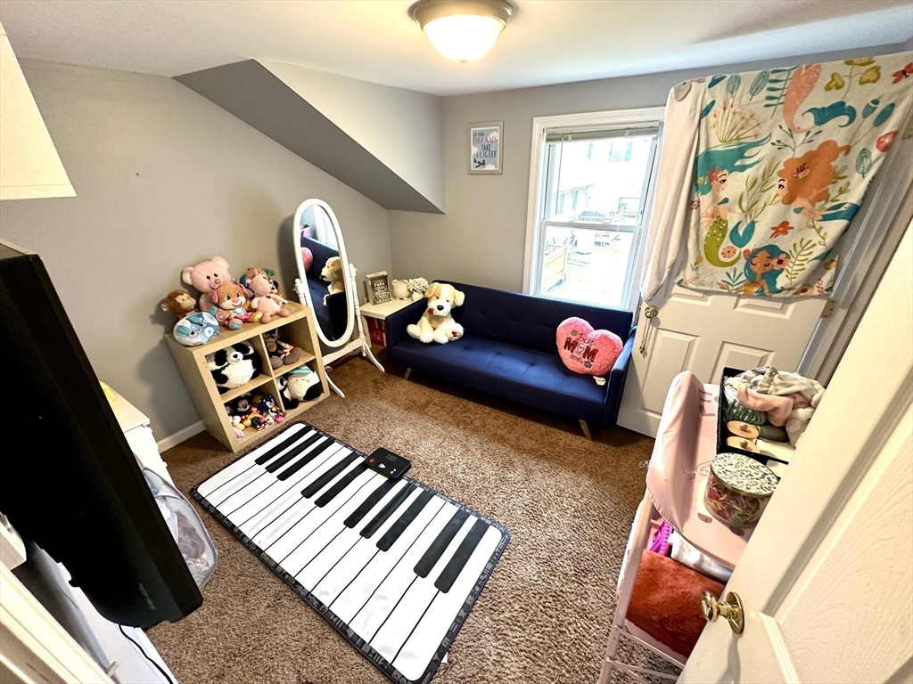 76 Everton Avenue Worcester, MA 01604 - Photo 20 of 38 a living room with furniture and floor to ceiling window