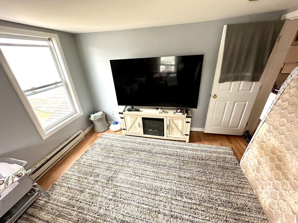 76 Everton Avenue Worcester, MA 01604 - Photo 26 of 38 a view of a livingroom with furniture and a flat screen tv