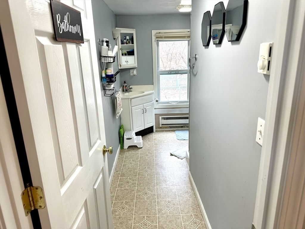 76 Everton Avenue Worcester, MA 01604 - Photo 28 of 38 a view of walk in closet with clothes and shoes