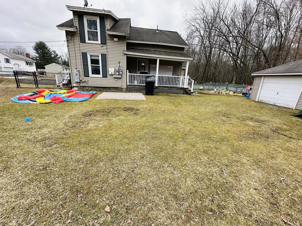 76 Everton Avenue Worcester, MA 01604 - Photo 33 of 38 a backyard of a house with dishwasher and outdoor kitchen