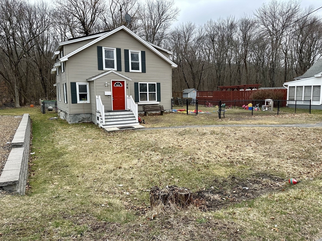 76 Everton Avenue Worcester, MA 01604 - Photo 5 of 38 a view of residential houses with yard and trampoline
