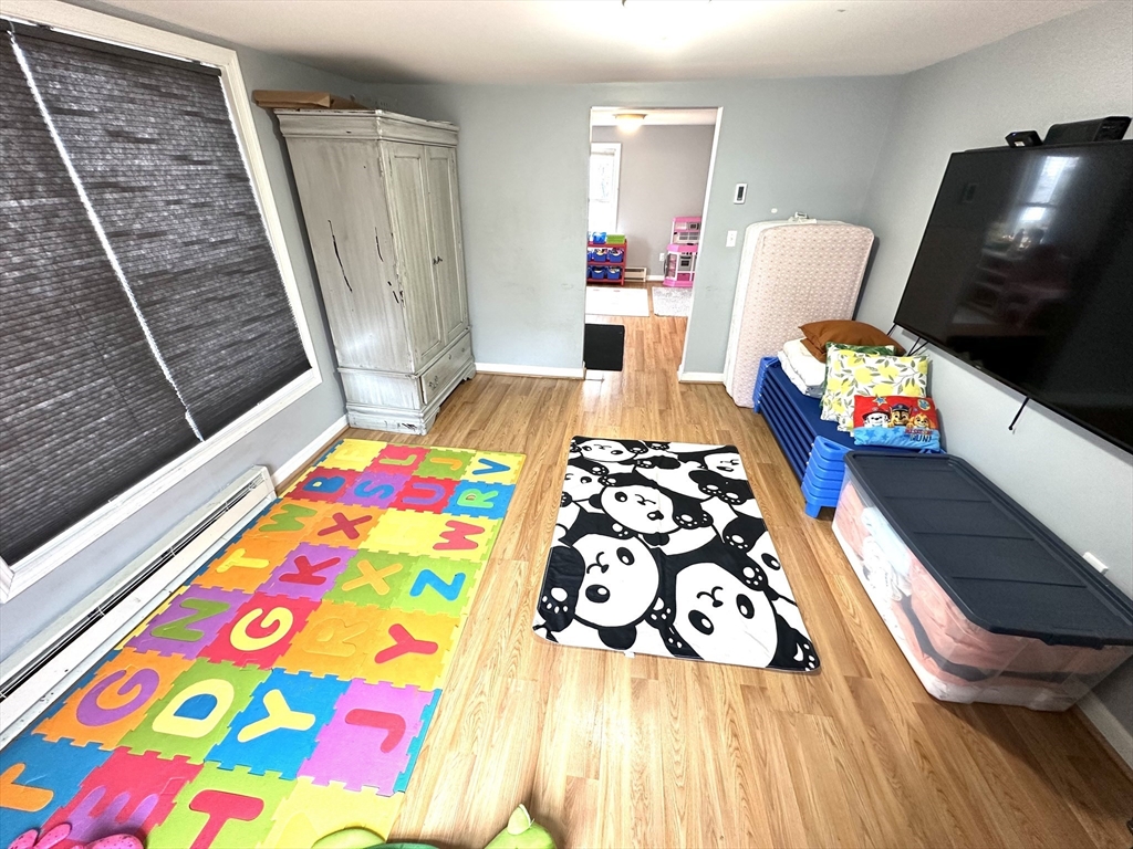 76 Everton Avenue Worcester, MA 01604 - Photo 9 of 38 a bedroom that has a bed and a chair in it