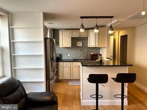 a kitchen with stainless steel appliances granite countertop a sink and a cabinets