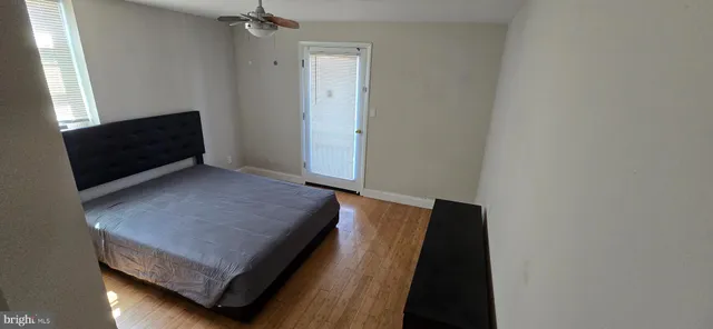 a room with wooden floor and chair