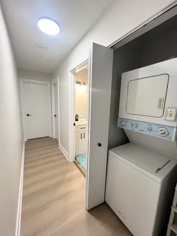 a view of storage and utility room with washer and dryer