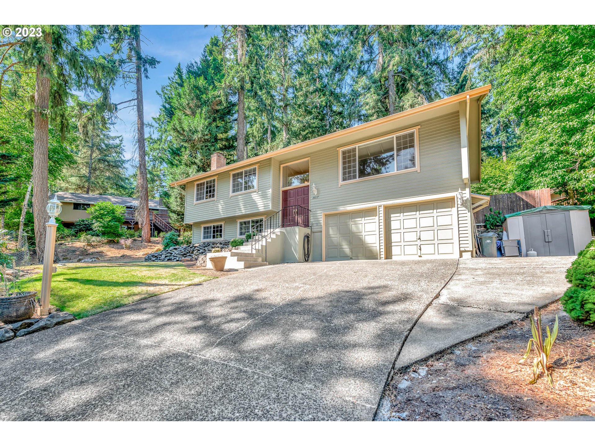 2817 Greentree Way Eugene, OR 97405 - Photo 1 of 44 a front view of a house with a yard and garage