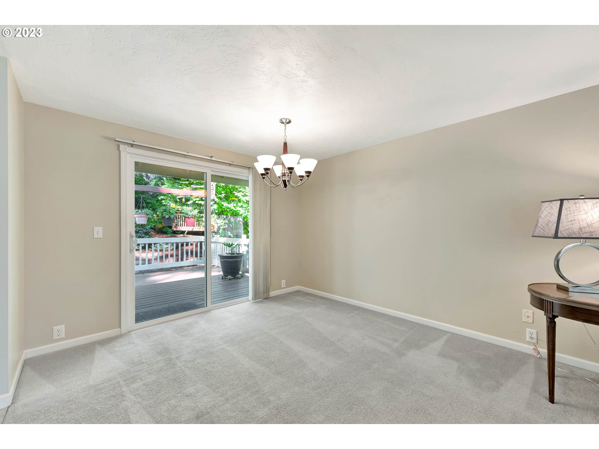 2817 Greentree Way Eugene, OR 97405 - Photo 11 of 44 a view of a livingroom with a chandelier fan and windows