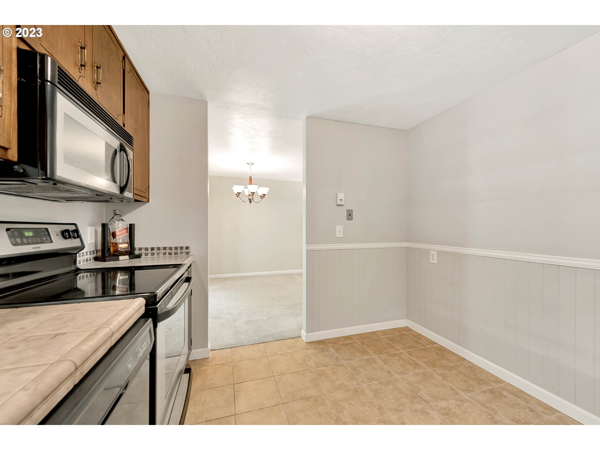2817 Greentree Way Eugene, OR 97405 - Photo 18 of 44 a kitchen with stainless steel appliances cabinets a stove and a refrigerator