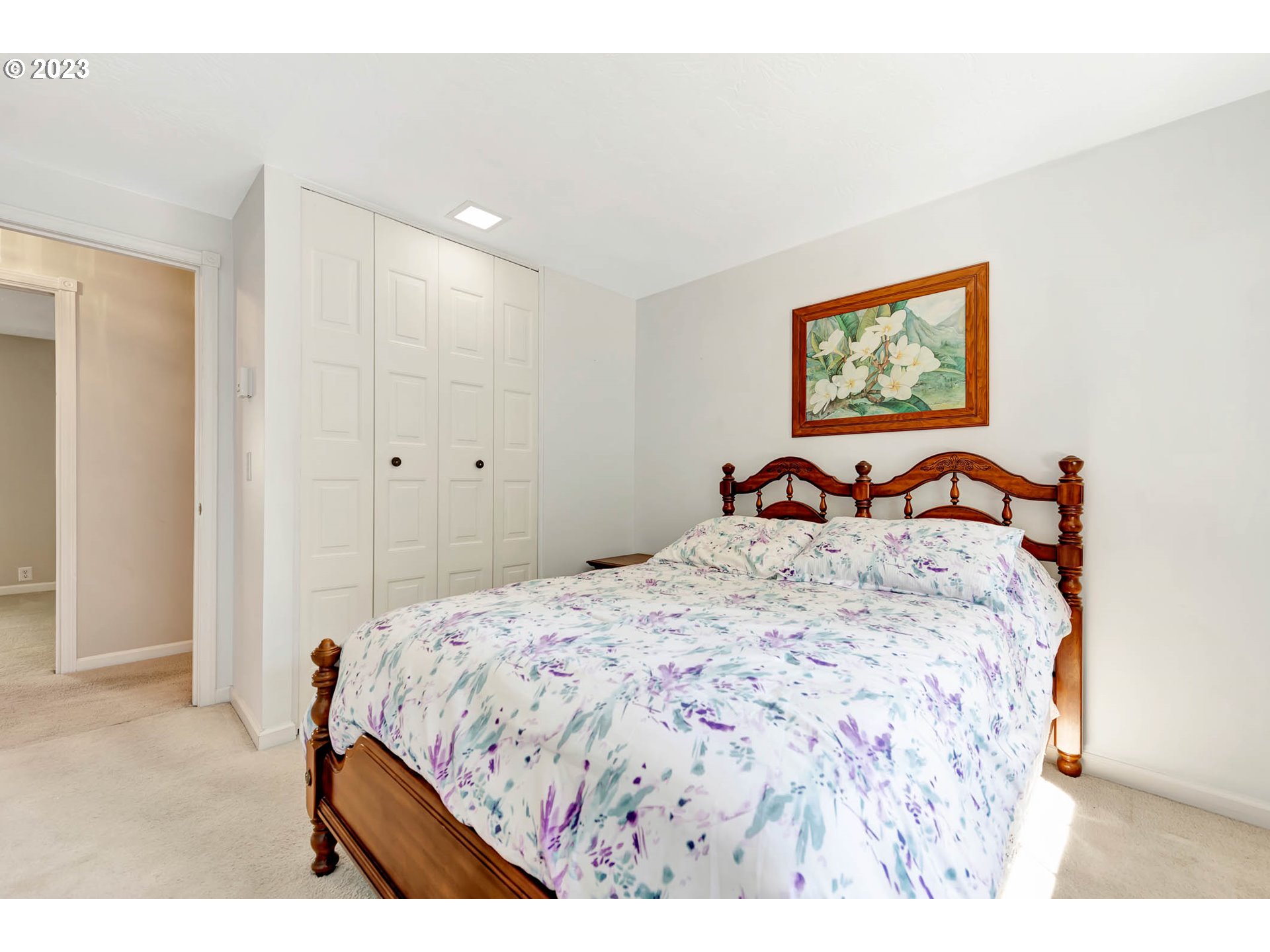 2817 Greentree Way Eugene, OR 97405 - Photo 22 of 44 a bedroom with a bed and a painting on the wall