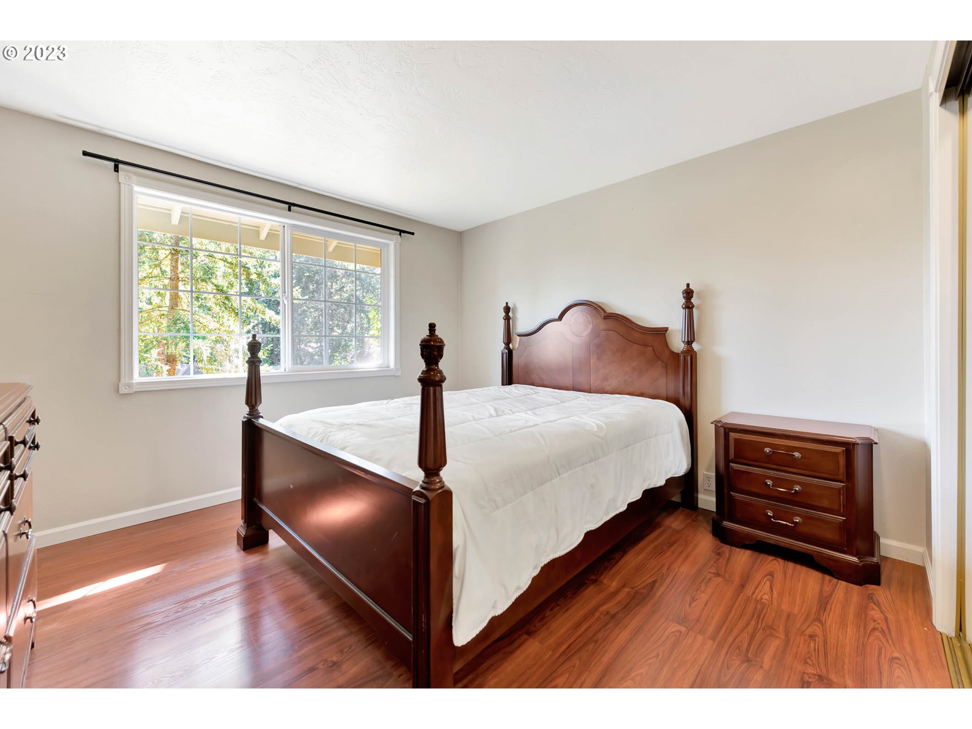 2817 Greentree Way Eugene, OR 97405 - Photo 23 of 44 a bedroom with a bed and a large window