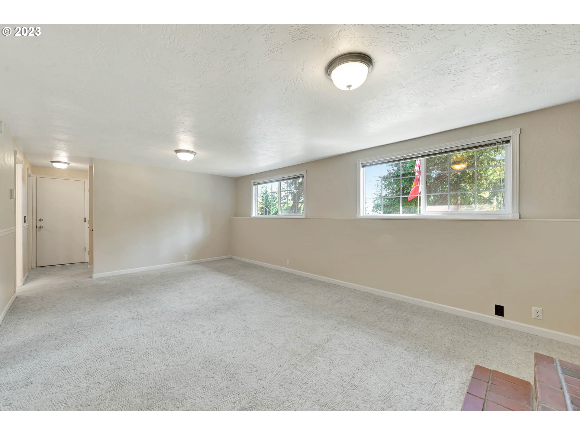2817 Greentree Way Eugene, OR 97405 - Photo 31 of 44 a view of an empty room with window and wooden floor