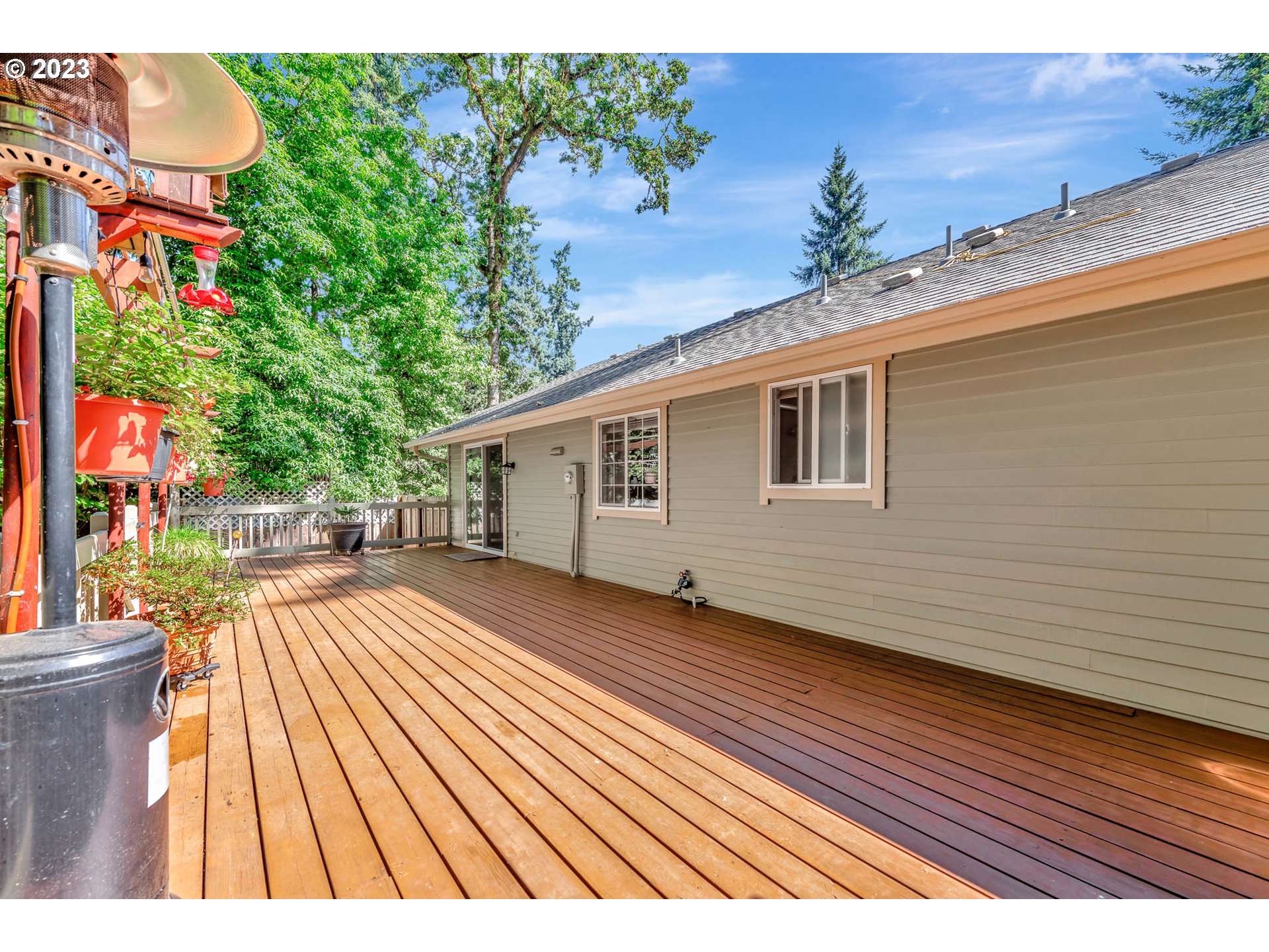 2817 Greentree Way Eugene, OR 97405 - Photo 37 of 44 a view of backyard with a deck and wooden floor