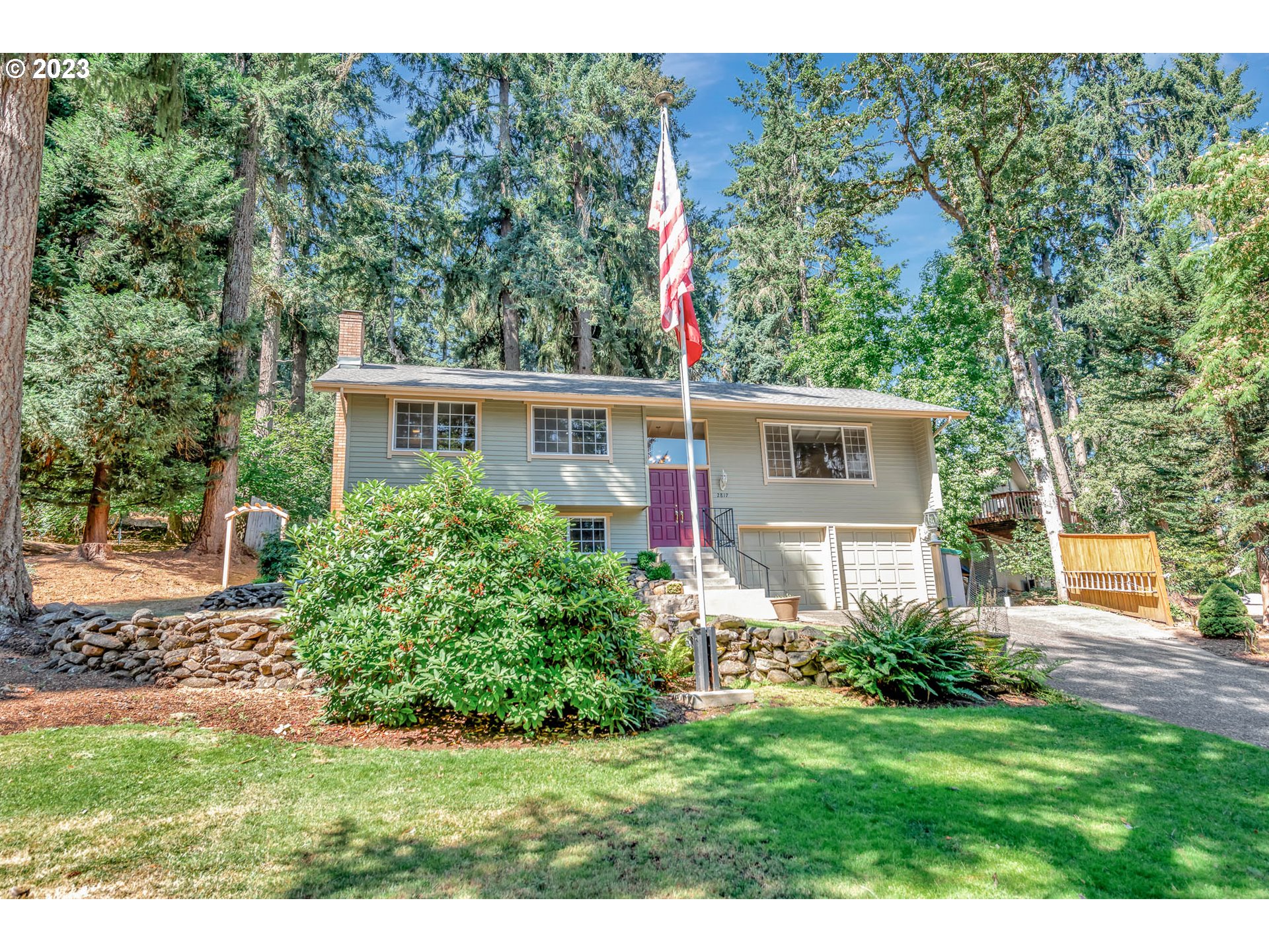 2817 Greentree Way Eugene, OR 97405 - Photo 4 of 44 a front view of a house with a yard