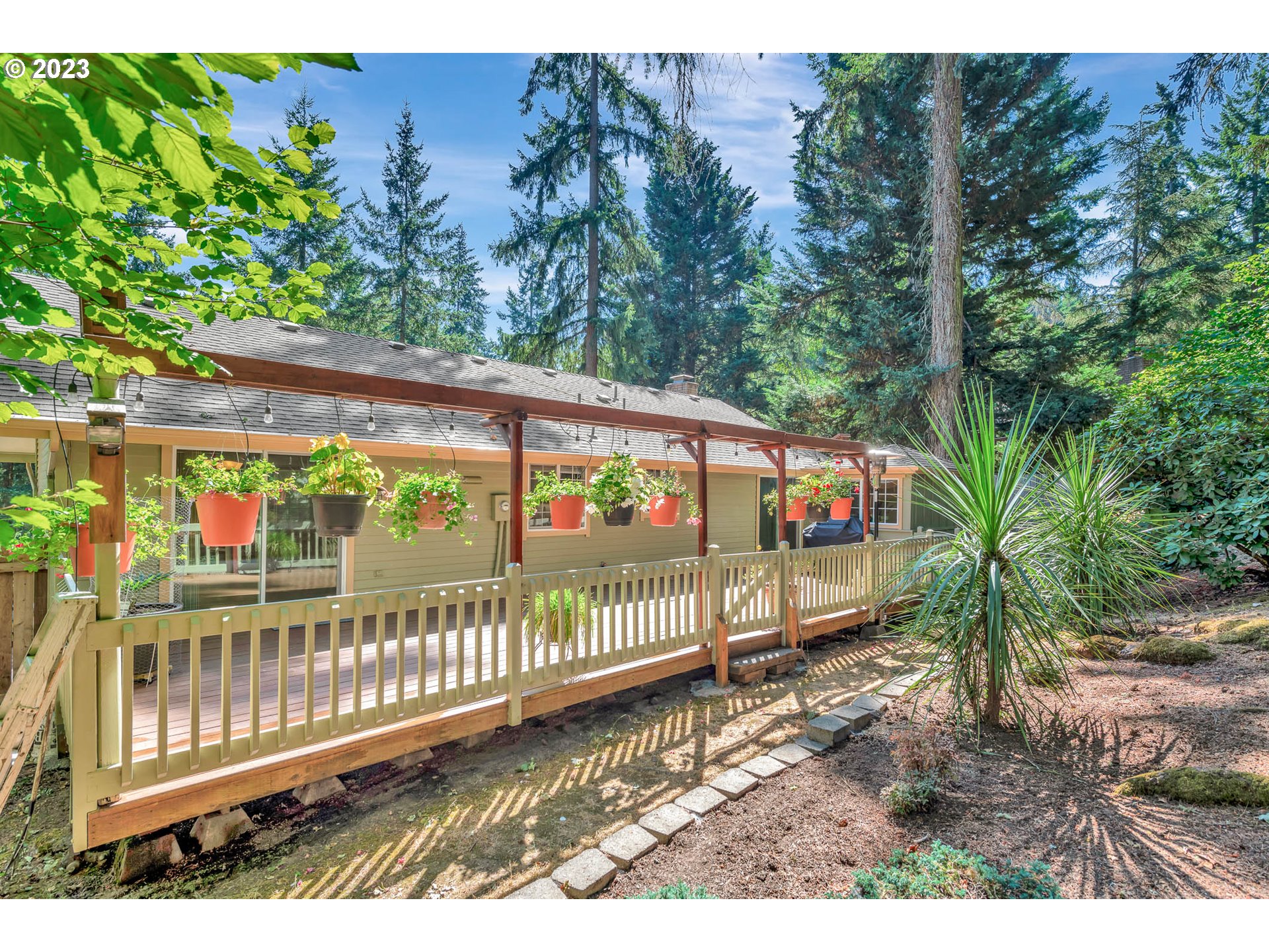 2817 Greentree Way Eugene, OR 97405 - Photo 44 of 44 a view of a porch with a bench