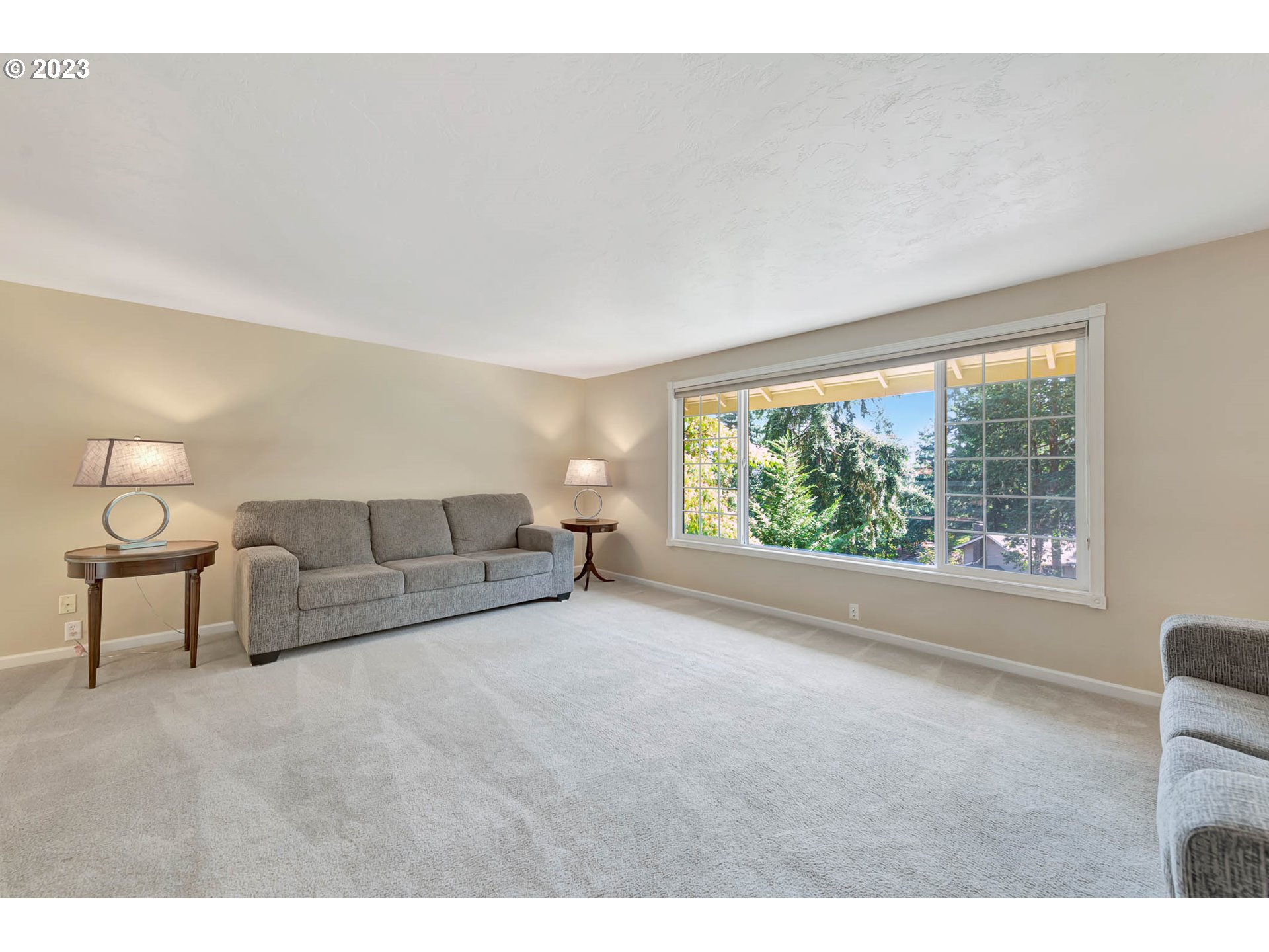 2817 Greentree Way Eugene, OR 97405 - Photo 7 of 44 a living room with furniture and a large window