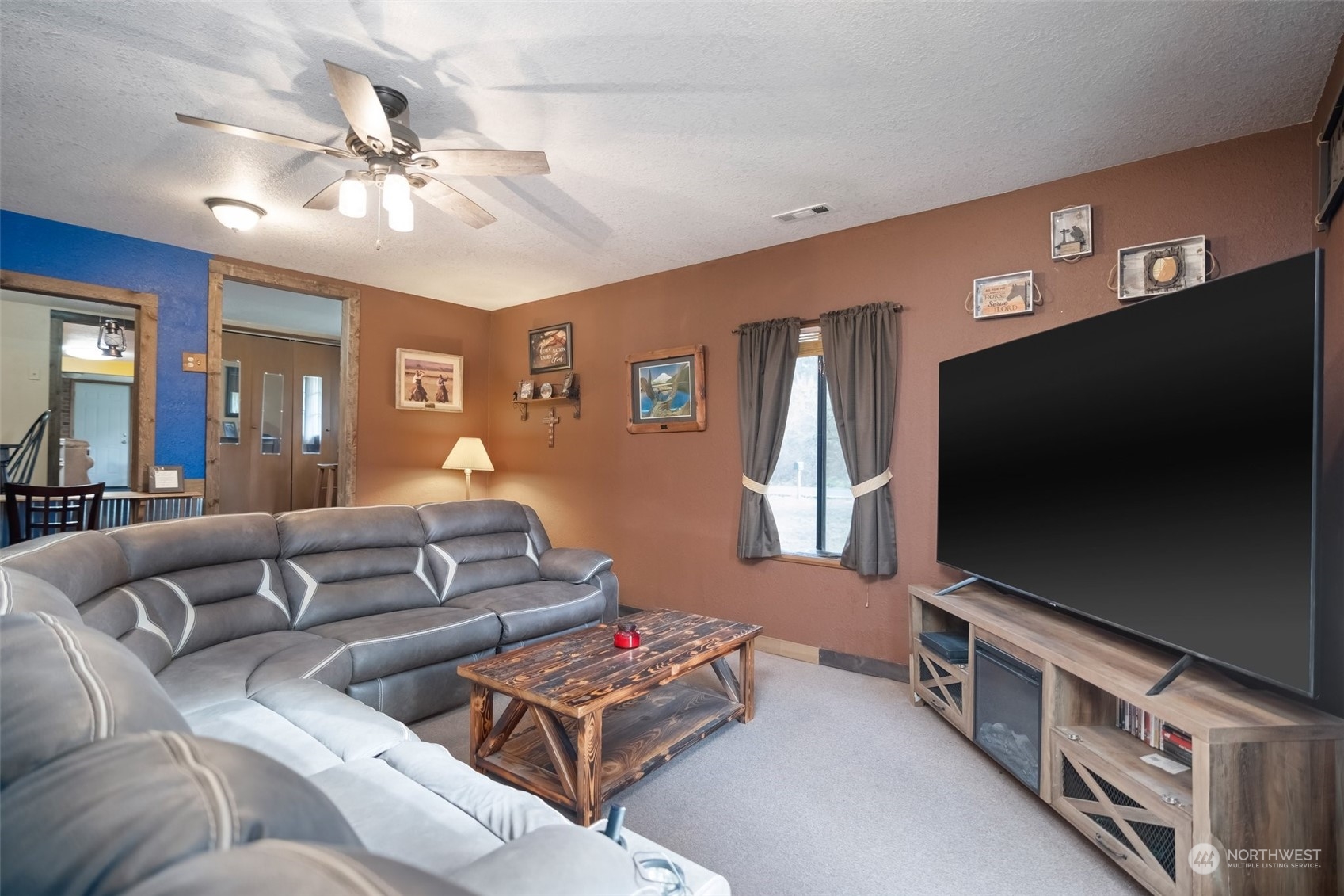 258 Coulson Road Chehalis, WA 98532 - Photo 14 of 37 a living room with furniture and a flat screen tv