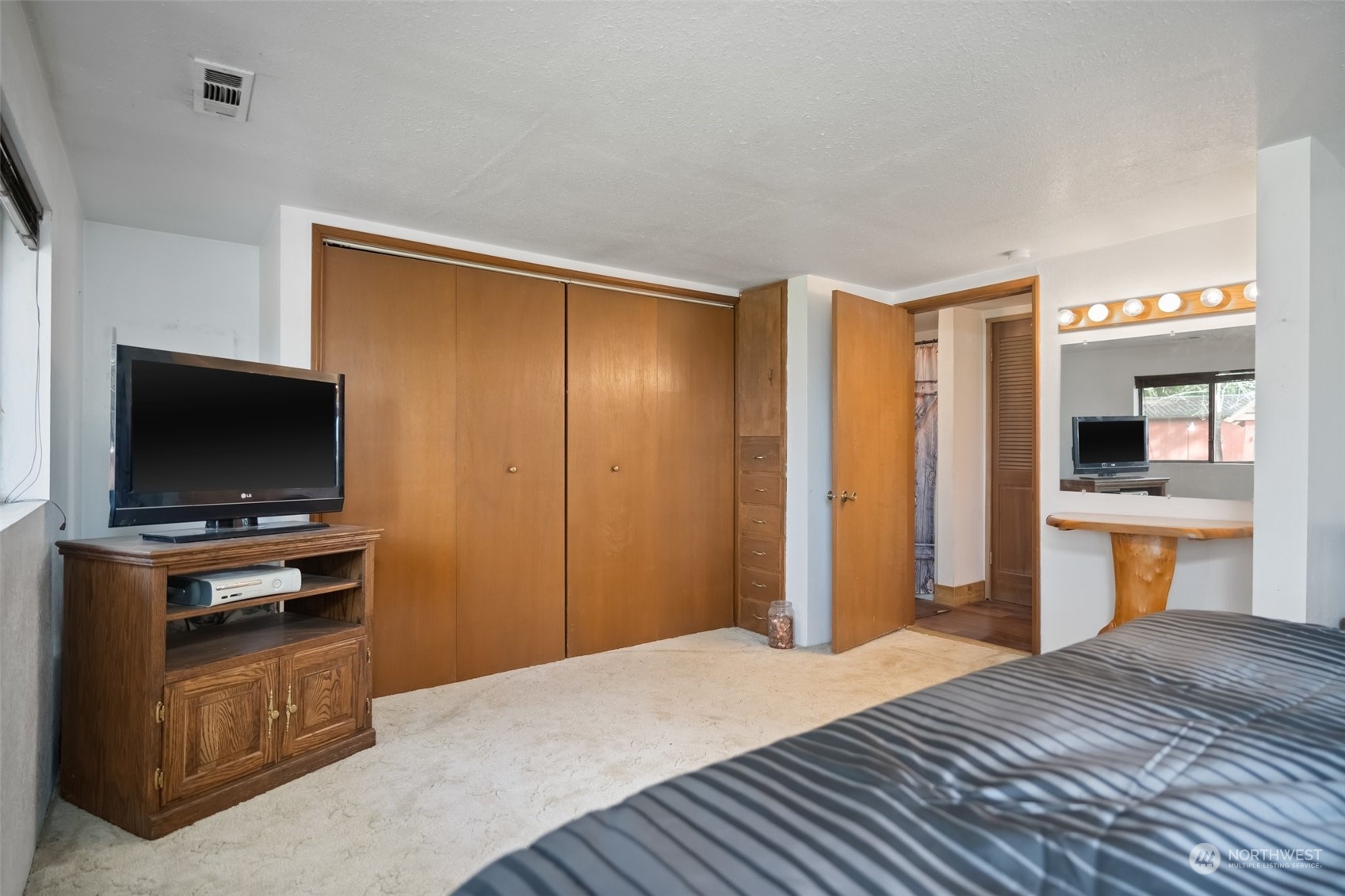 258 Coulson Road Chehalis, WA 98532 - Photo 21 of 37 a bedroom with a bed and a flat screen tv