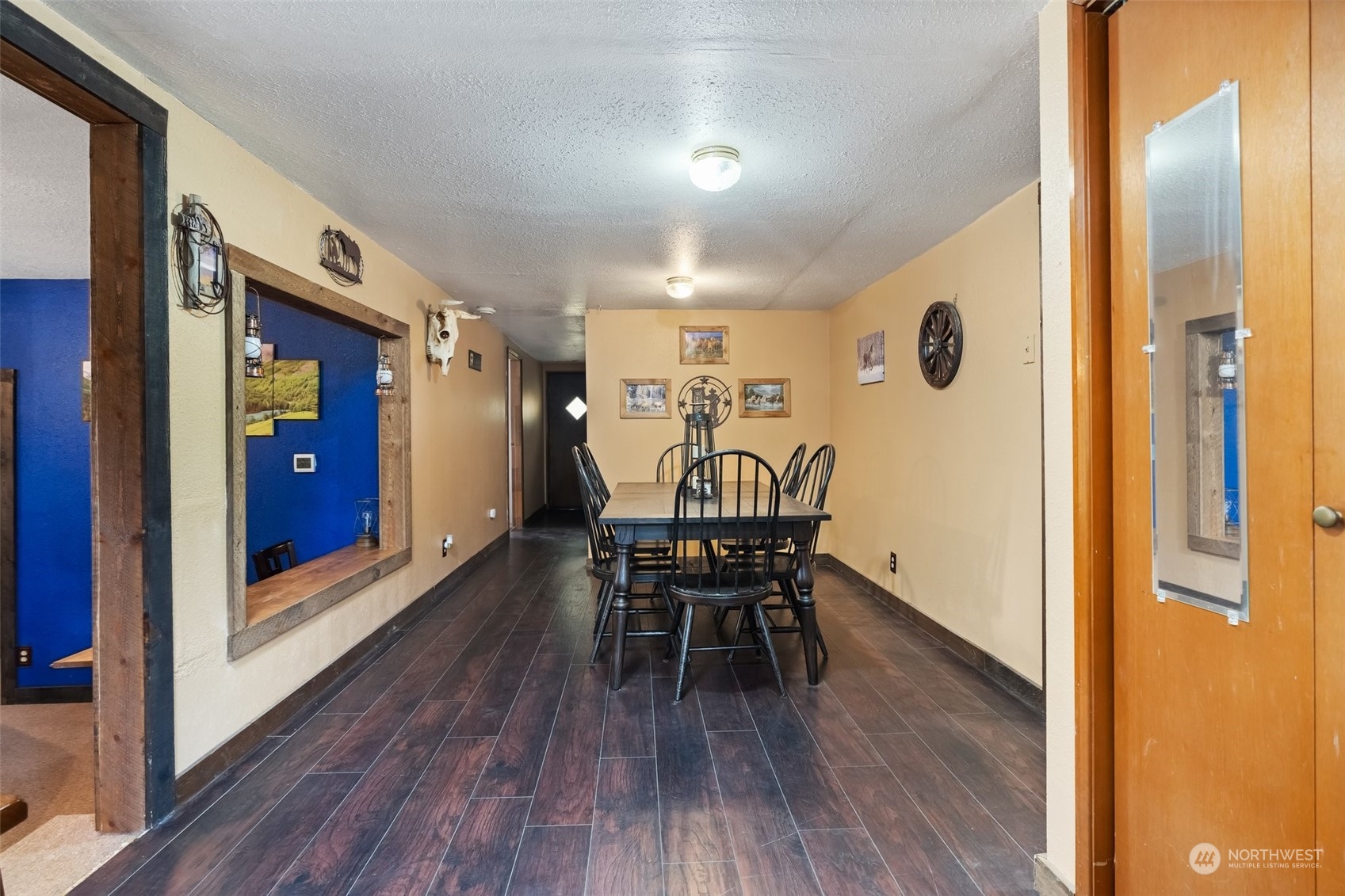258 Coulson Road Chehalis, WA 98532 - Photo 5 of 37 a view of a dining room with furniture and wooden floor