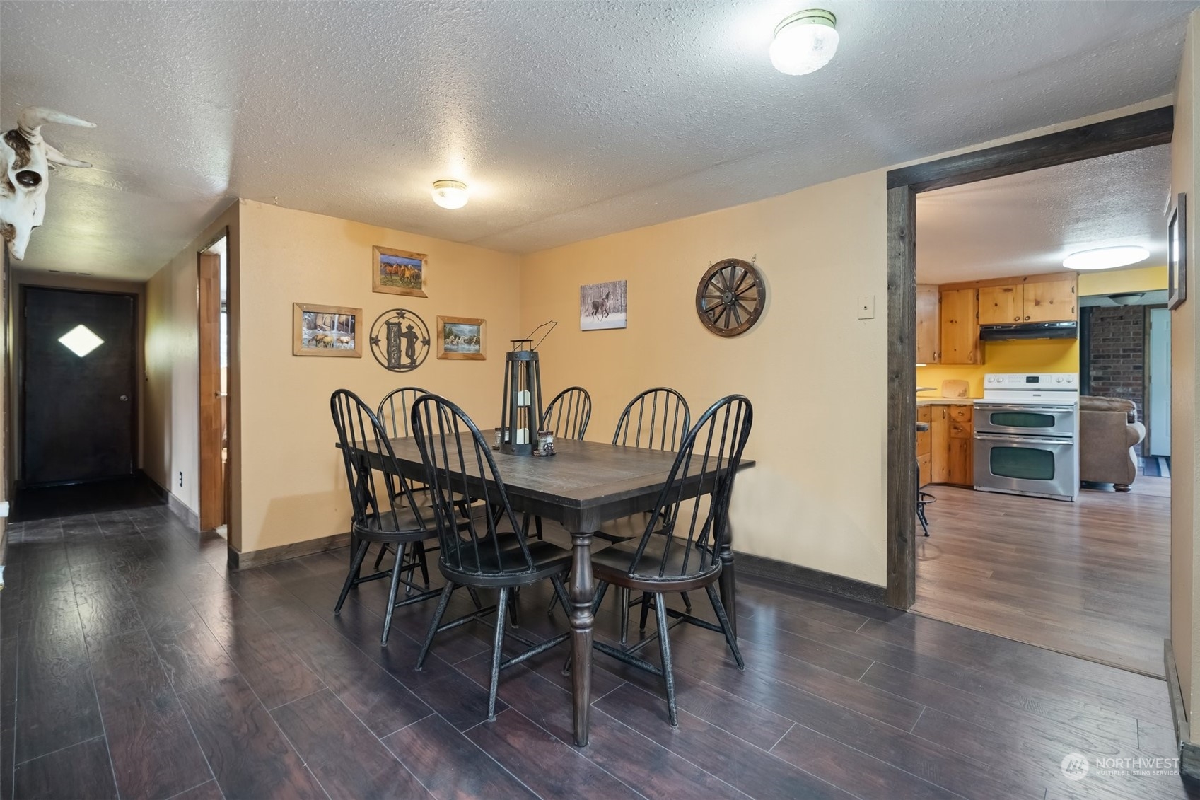258 Coulson Road Chehalis, WA 98532 - Photo 6 of 37 a view of a dining room with furniture and wooden floor