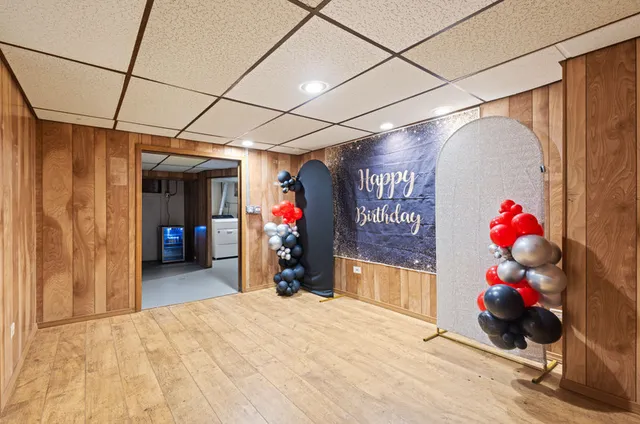 a view of empty room with wooden walls